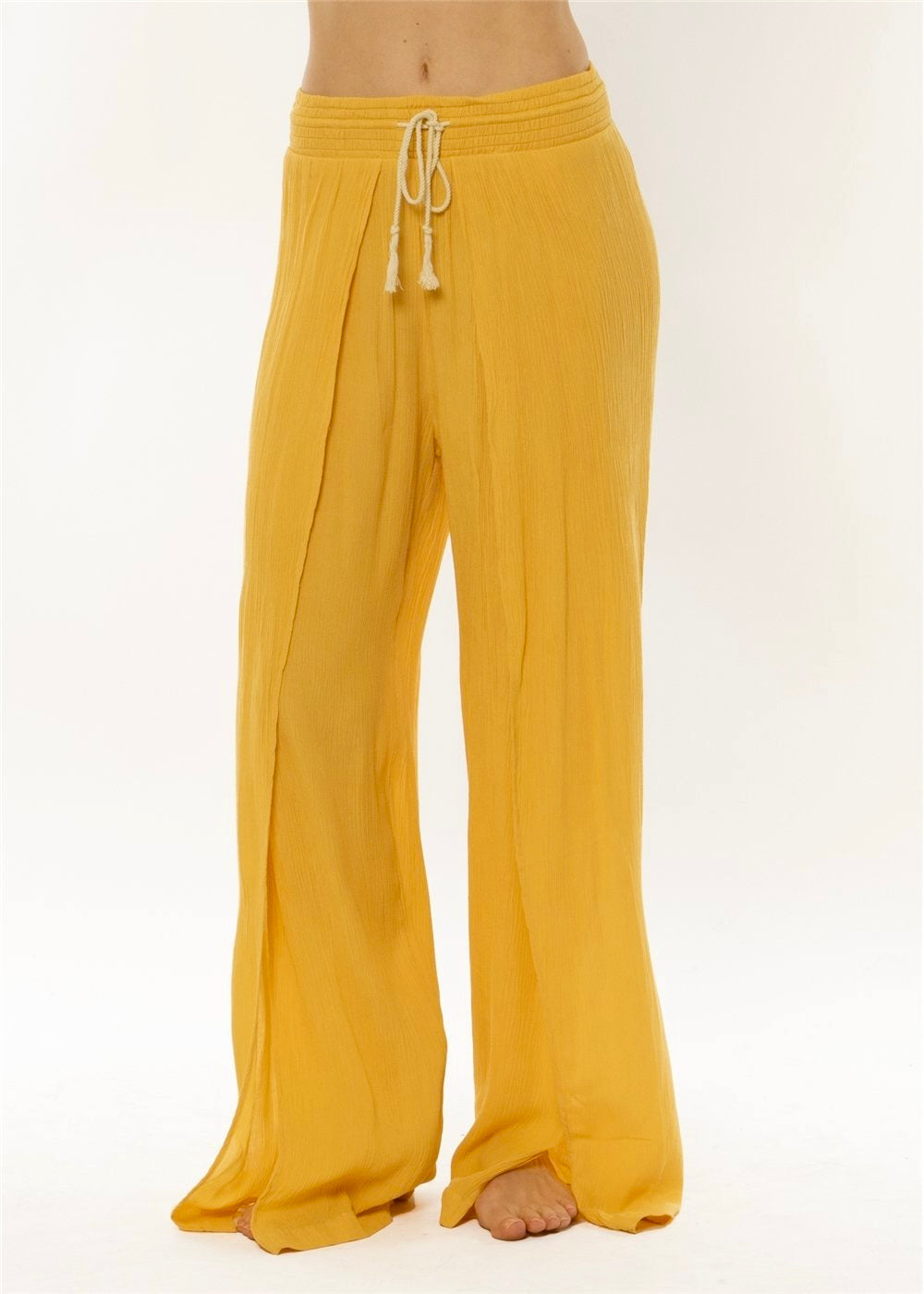 Yellow pants with a drawstring on a white background
